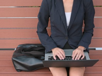 Businesswoman working on notebook computer